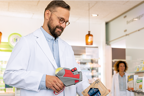 Meto Expert price labeler in use for marking and labeling products in a pharmacy